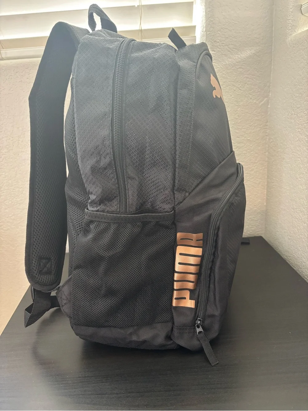 Puma Black Backpack with Copper Puma Logo